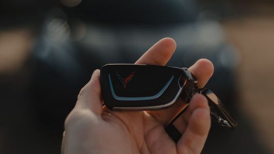 Hand holding a car key fob